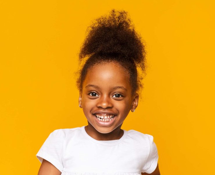 portrait-of-african-little-girl-smiling-over-GXAWB8R.jpg