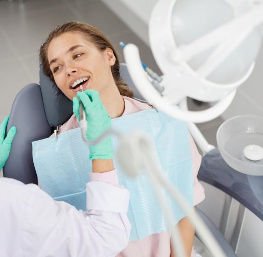 young-woman-at-dental-exam-3XD85GH.jpg