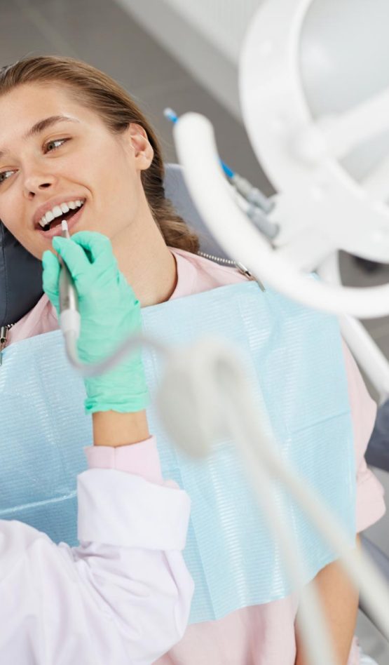 young-woman-at-dental-exam-3XD85GH.jpg